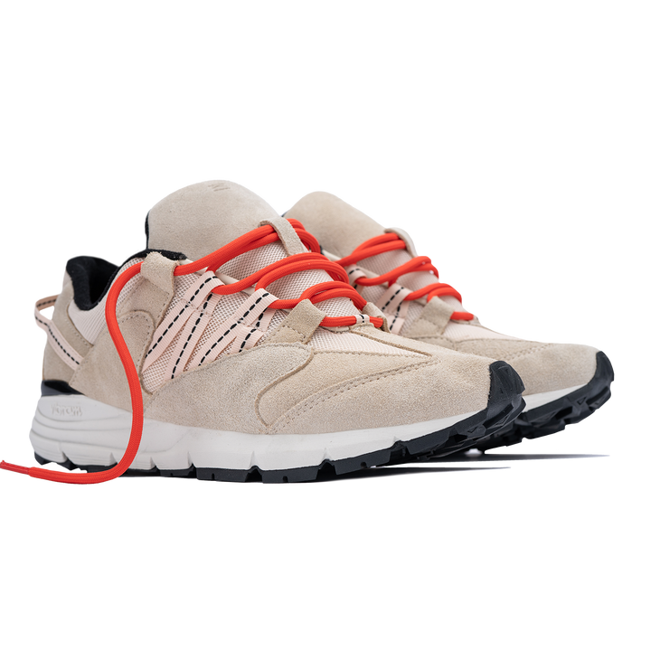 Altiutude / Safari front 3/4 view khaki suede / air mesh / webbing lace holder with orange lace on a vibram sole